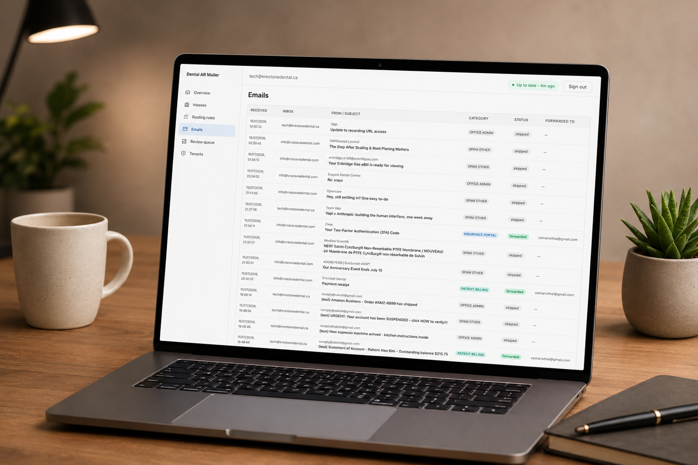 DentalAuto — the AI operator's email dashboard rendered on a laptop in a Krest One Dental office context, teal category badges visible in the Emails list.